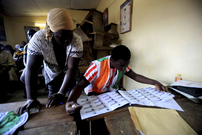 Ivorians vote for the presidential election in Abidjan on October 31.