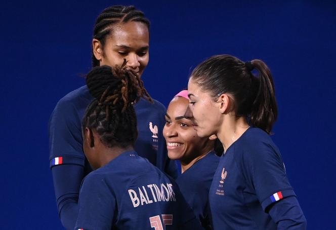 Perle Morroni, center, is congratulated by his partners after his first goal for the France team.