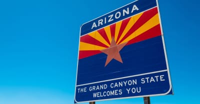 Arizona state border highway sign with blue sky background