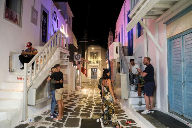 Tourists in an alleyway in Mykonos during curfew on July 18, 2021.