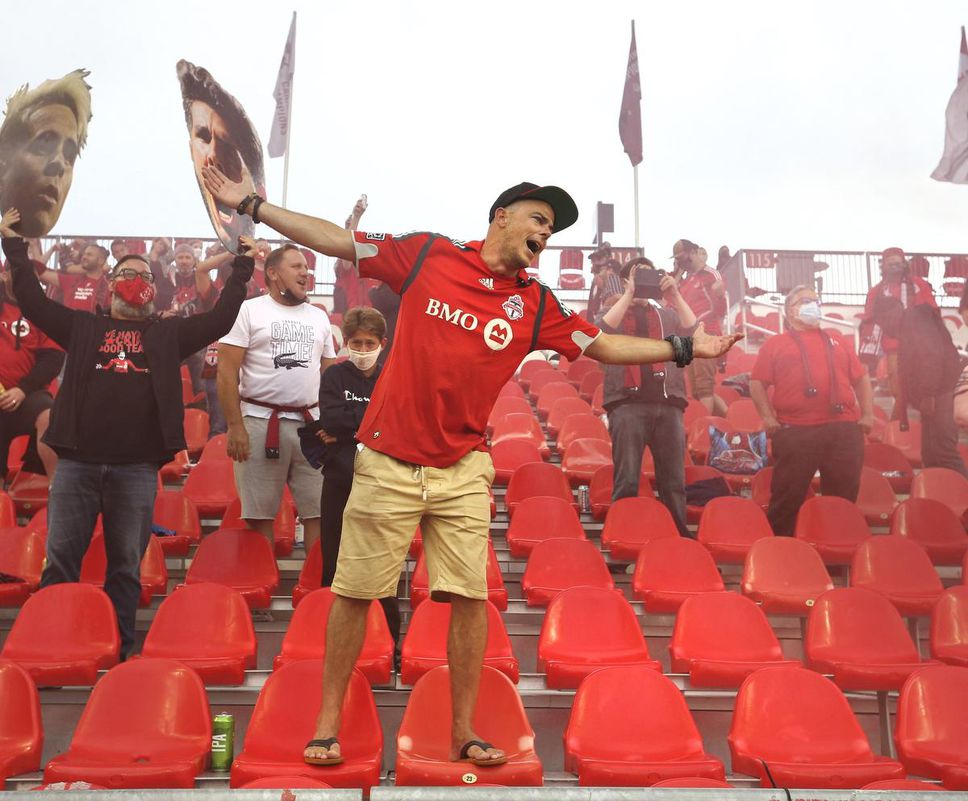 Toronto FC fans cheer at the first home game with spectators allowed in more than a year.  About 7,000 people?  A mix of frontline healthcare workers, subscribers, and lottery winners?  watched the team fight for a 1-1 draw against Orlando City FC.
