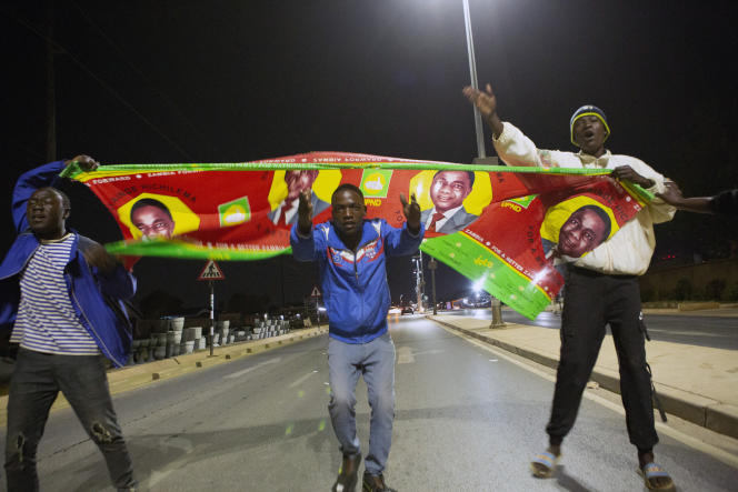 Hakainde Hichilema supporters celebrate the victory of their Zambian presidential candidate in Lusaka on August 15, 2021.