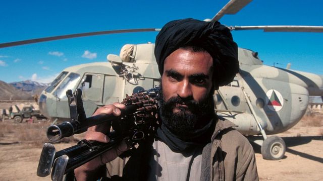 Taliban militant with a machine gun.