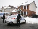 Laval police in front of a house on Monday, January 4, 2021, where a 7-year-old girl died on Sunday.