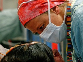 A nurse talks to a patient at the University of Alberta Hospital in Edmonton.  File photo.