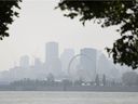 Haze and smog filled the Montreal skyline as seen from Ile-Sainte-Hélène, Monday, July 26, 2021. On Tuesday, temperatures reached 38 C with the humidex at noon.