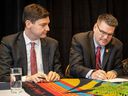 British Columbia Attorney General David Eby and Doug White, Chairman of the British Columbia First Nations Justice Council, sign a strategic agreement.