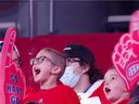 Young Habs fans cheer when the Montreal Canadiens are introduced for a Reds-White fight at the Bell Center on September 26, 2021. 