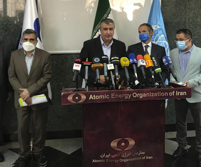 The director of the Iranian Atomic Energy Agency, Mohammad Eslami (center), in Tehran, September 12, 2021.