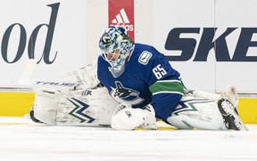 Vancouver Canucks goalie Michael Dipietro # 65 stretches during pregame warm-up prior to NHL hockey action at Rogers Arena against the Toronto Maple Leafs on April 17, 2021 in Vancouver, Canada.