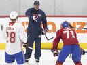 Christian Dvorak and Jake Evans listen as head coach Dominique Ducharme gives instructions during the Canadiens' training camp on Friday at the Bell Sports Complex in Brossard.