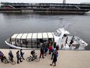 Crowds line up to board the ferry from the Old Port to Pointe-aux-Trembles River in Montreal's Old Port on May 28, 2018. 