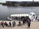 Crowds line up to board the Old Port water taxi to Pointe aux Trembles in Montreal's Old Port on Monday, May 28, 2018.