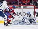Canadiens forward Christian Dvorak (28) scores a goal against Toronto Maple Leafs goalkeeper Jack Campbell (36) during the first period at the Bell Center on Monday, Sept. 27, 2021.