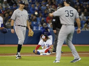 Bo Bichette of the Toronto Blue Jays sits on third base after being called out trying to steal against the New York Yankees on Tuesday night.
