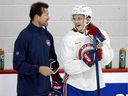 Montreal Canadiens defensive prospect Sami Niku speaks with assistant coach Luke Richardson during training camp in Montreal on September 29, 2021. 