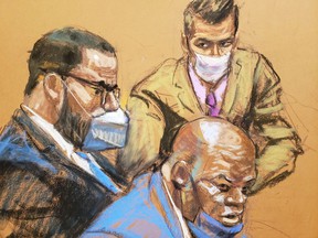 R. Kelly sits with his attorneys Calvin Scholar and Thomas Farinella as the jury deliberates in Kelly's sexual abuse trial in Brooklyn Federal District Court in a sketch of the courtroom in New York, USA, September 27, 2021.