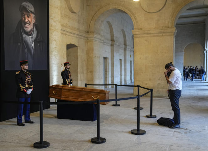 A man meditates in front of the remains of Jean-Paul Belmondo, at the Hôtel des Invalides, in Paris, on September 9, 2021.