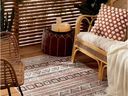 Outdoor rugs, soft pillows, screens, curtains, and candlelight are ways to create a warm and inviting patio on cool fall nights.  Artefact vinyl rug, $ 90, Simons.ca