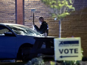Police are investigating the scene of an accident that injured 7 people after a woman lost control of her car in a parking lot at the Sunshine Academy polling station in Montreal on September 20, 2021.
