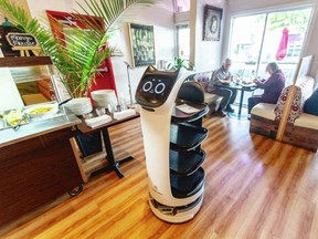 Robbie the robot brings food to the tables of the Mantra restaurant on Fort Street in Victoria.