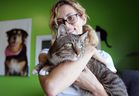 Lauren Edwards of Moggy Cat Rescue holds tabby Tom Tom Wednesday at the Humane Society of Windsor / Essex County on Provincial Road.  Tom Tom is one of several pets that Edwards and his colleagues rescued from the flood-ravaged state of Texas following the destruction of Hurricane Harvey.