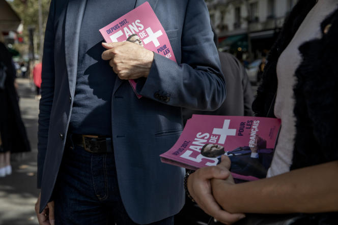 Activists from La République en Marche tow for the party in Paris on September 12, 2021.