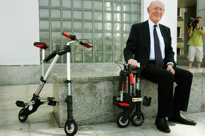 Clive Sinclair poses, July 12, 2006 in London, next to one of his inventions, the A-bike.