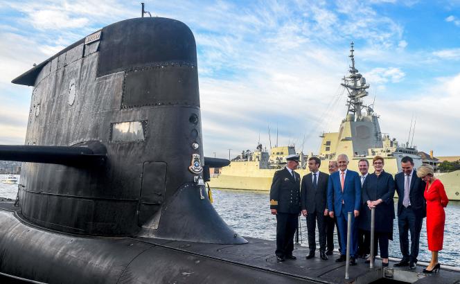 French President Emmanuel Macron and former Australian Prime Minister Malcom Turnbull on the deck of an Australian Navy-operated submarine in Sydney, May 2, 2018.