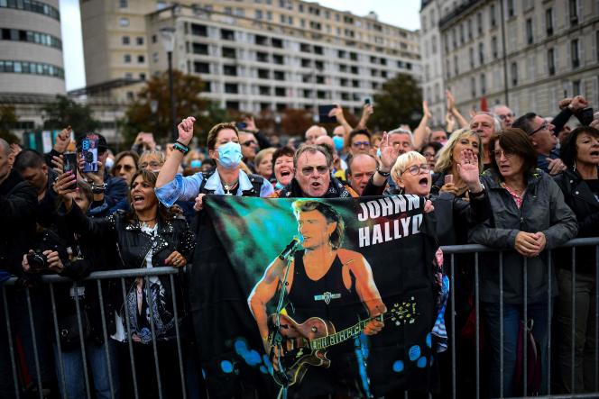Johnny Hallyday fans on the esplanade which now bears his name, in Paris, Tuesday, September 14, 2021.