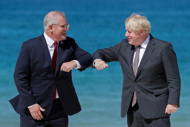 British Prime Minister Boris Johnson (right) greets his Australian counterpart Scott Morrison at the G7 summit in Carbis Bay, Britain on June 12, 2021.