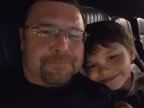 Daniel Winston Robinson, seen with his son, died on August 30, 2021, after a "altercation" at the Edmonton Remand Center.  Police have deemed the death not criminal, but Robinson's family continues to press for answers.