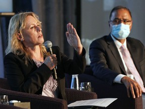Edmonton mayoral candidate Kim Krushell, left, speaks at a mayoral forum held at the Westin Hotel in Edmonton on Thursday, Sept. 9, 2021.