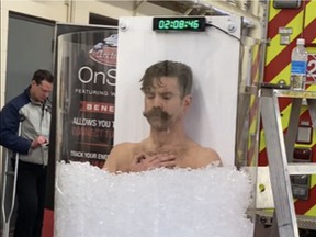 Edmonton firefighter Wes Bauman on his way to setting a new two-hour, 20-minute ice bath record at Firehall 2 in February of last year.