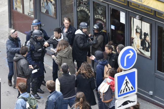 Alexandre Benalla, in the center with a helmet, during an altercation with demonstrators on the sidelines of the May Day parade, in Paris, in 2018.