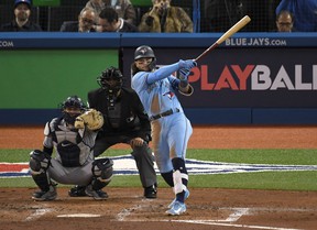 Blue Jays shortstop Bo Bichette hits a solo home run against the New York Yankees in the third inning at the Rogers Center on Wednesday, Sept. 29, 2021. Mandatory Credit: Dan Hamilton-USA TODAY Sports