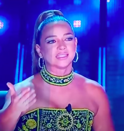 The host of Así se Baila in controversial dress