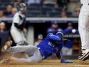 Blue Jays runner Lourdes Gurriel Jr. scores on a wild pitch by Yankees pitcher Lucas Luetge during the fourth inning at Yankee Stadium in New York City, Wednesday, Sept. 8, 2021.