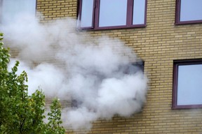 Smoke comes out of the window of an apartment building where an explosion occurred, in the Annedal district of central Gothenburg, Sweden, on Tuesday, September 28, 2021.