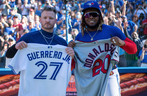 Former Blue Jays star Josh Donaldson (left) and current MVP candidate Vladimir Guerrero Jr. swap jerseys after Toronto defeated the Twins on Sunday, Sept. 19, 2021.