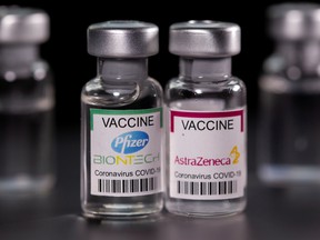 Vials with the Pfizer-BioNTech and AstraZeneca (COVID-19) coronavirus disease vaccine labels are seen in this illustration image taken on March 19, 2021.