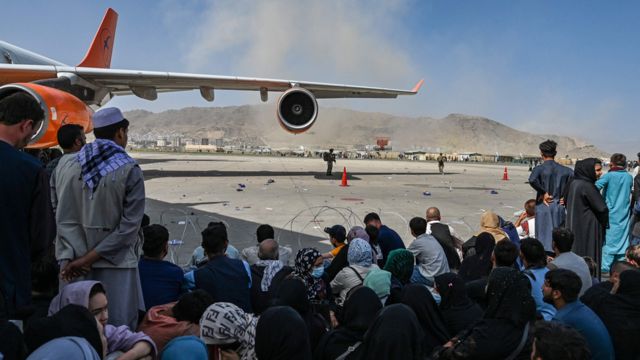 Afghans waiting to leave Kabul airport on August 16, 2021.