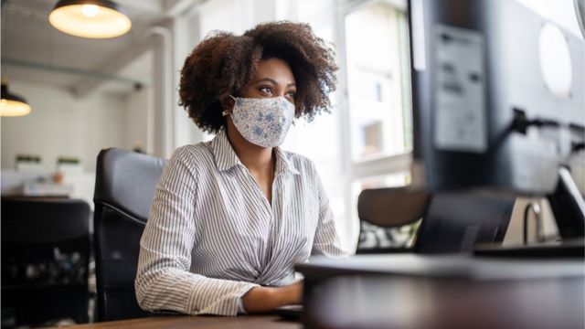 Woman in front of her computer.