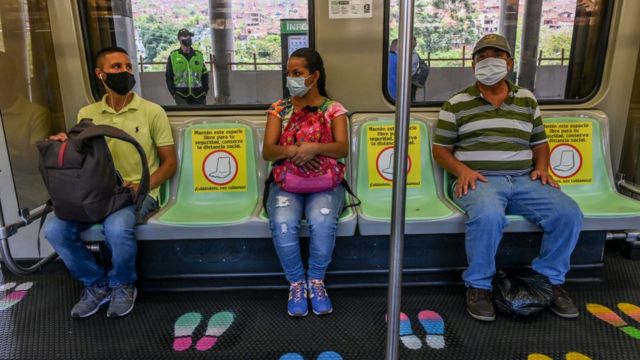 People wearing masks in the Medellín metro.
