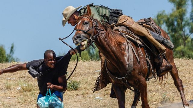 A border patrol agent fights with a Haitian