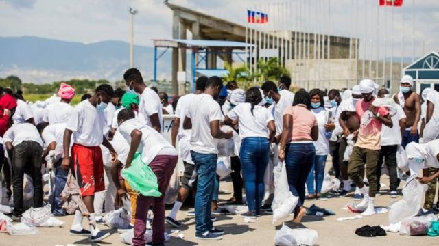People search for their belongings at the Port-au-Prince airport
