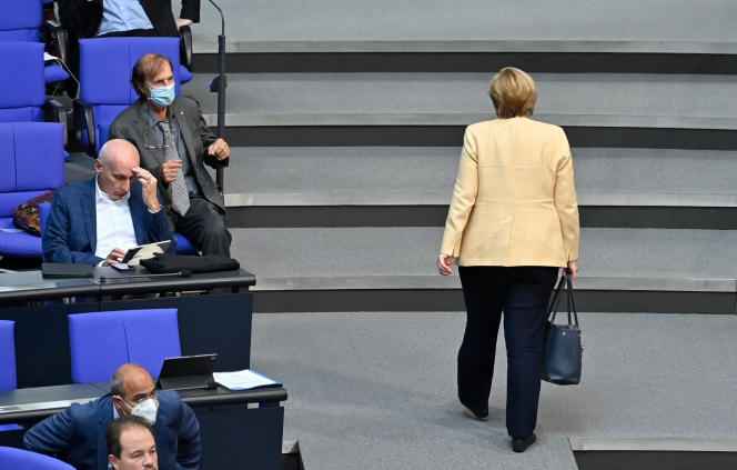 German Chancellor Angela Merkel leaves the Bundestag plenary session in Berlin on September 7, 2021.