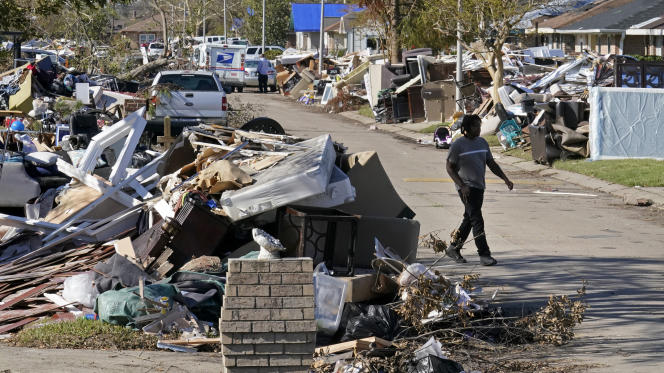 A man walks past the wreckage of his home ravaged by Hurricane Ida, in LaPlace, Louisiana, September 10, 2021.