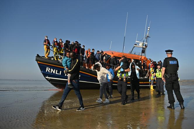 Migrants disembark at Dungeness, in the south of England, on September 7, 2021, after being rescued by the Royal National Lifeboat Institution, a charity rescuing people in danger at sea in the waters of the British Isles.