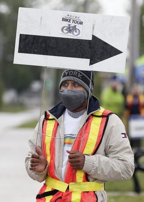 Subbarao Chaganti provides direction in Kingsville on Saturday 25 September 2021 during the Essex Region Bicycle Conservation Tour event.